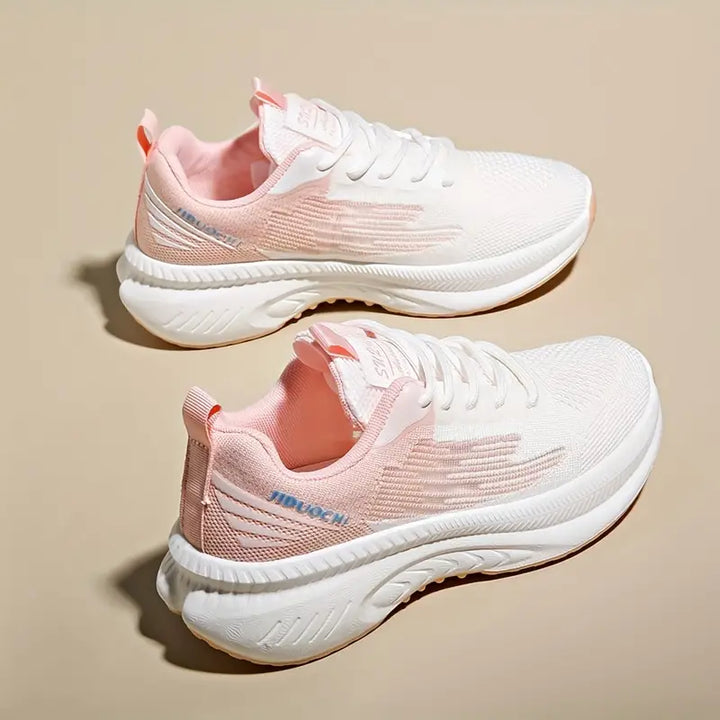 Damskie ortopedyczne buty sportowe w pastelowym różu, lekkie i oddychające, nowoczesny design dla codziennego komfortu i stylu.