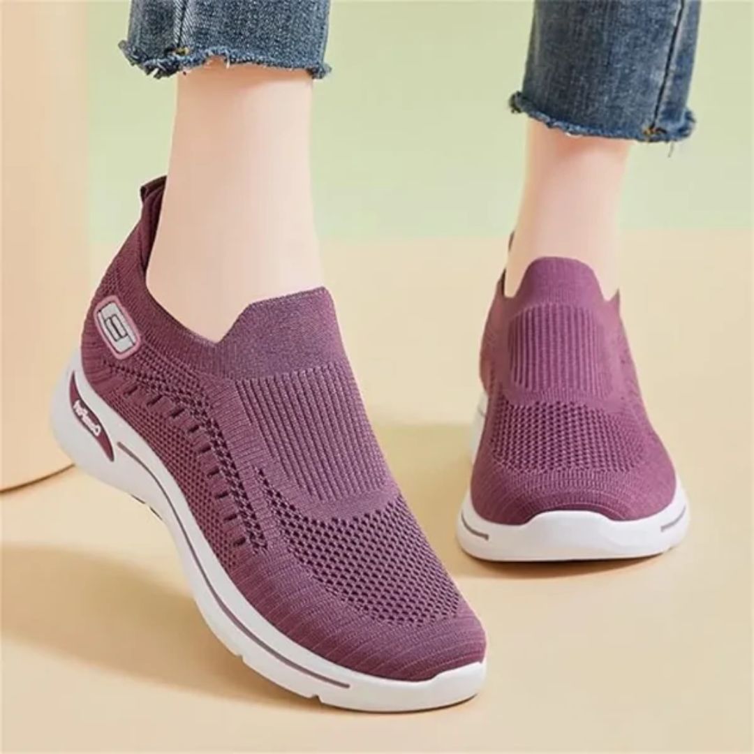 Damskie buty sportowe ortopedyczne w kolorze ciemnoszarym, nowoczesny styl i wygodne podeszwy, elegancki widok z boku.