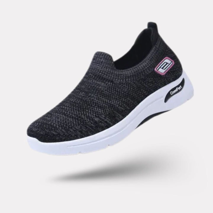 Damskie buty sportowe ortopedyczne w kolorze ciemnoszarym, nowoczesny styl i wygodne podeszwy, elegancki widok z boku.