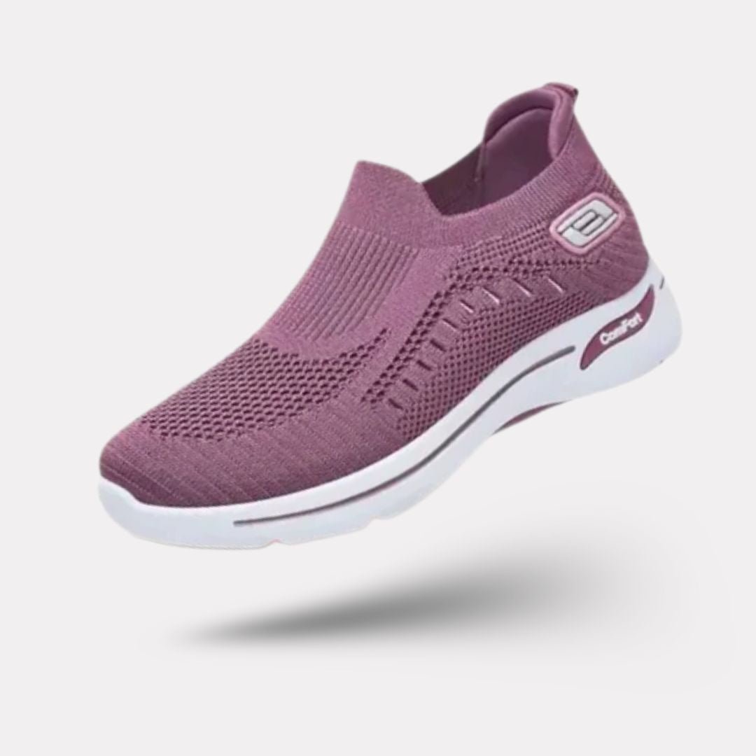 Damskie buty sportowe ortopedyczne w kolorze ciemnoszarym, nowoczesny styl i wygodne podeszwy, elegancki widok z boku.