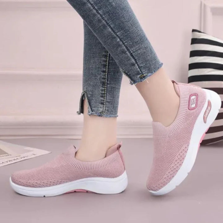 Damskie buty sportowe ortopedyczne w kolorze ciemnoszarym, nowoczesny styl i wygodne podeszwy, elegancki widok z boku.