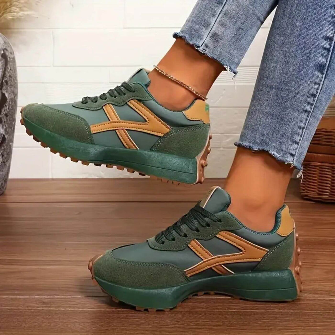 Zbliżenie na zielone sneakersy damskie Daphina, podkreślające detale i jakość wykonania.