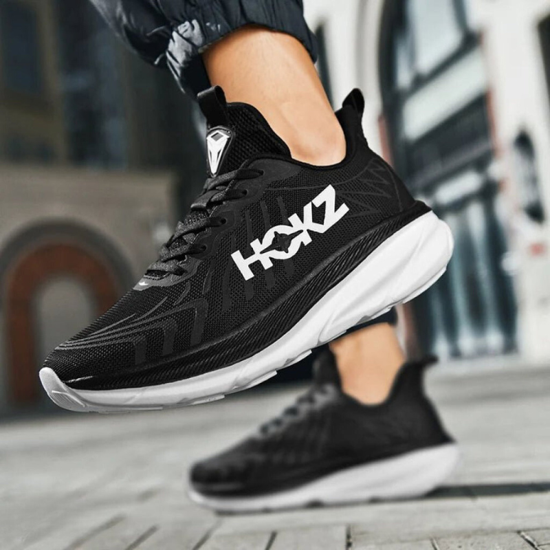Lekkie buty do biegania damskie w kolorze czarno-białym, z amortyzacją, nowoczesny design, widok z boku