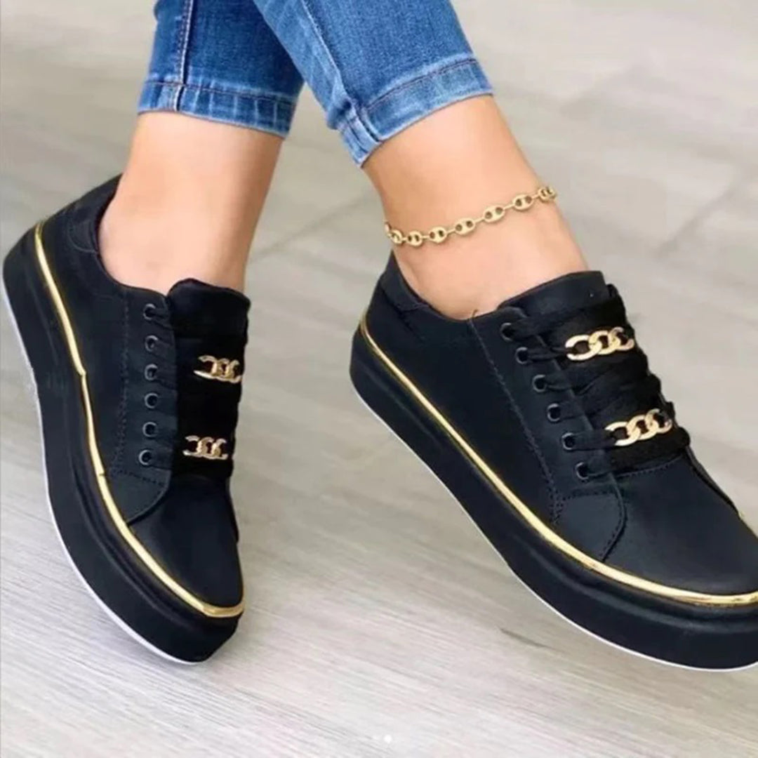 Białe damskie buty sportowe Nina, nowoczesny design, elegancja i komfort, idealne do miejskiego i aktywnego stylu.