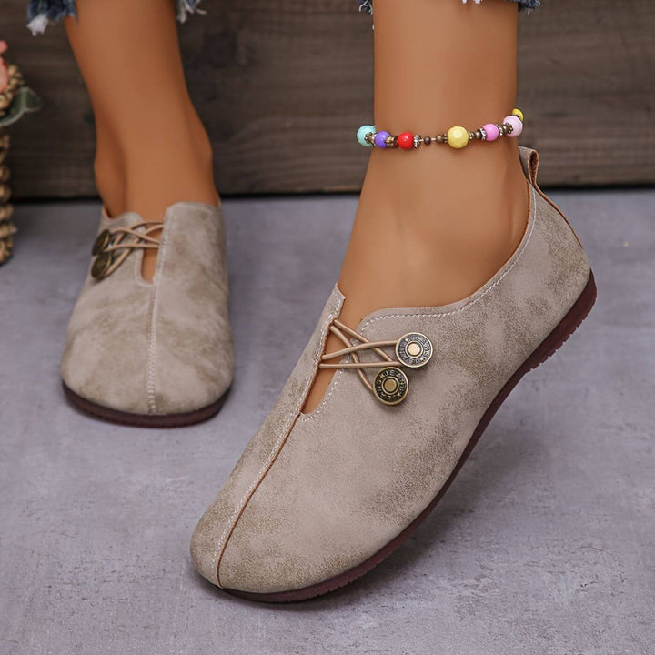 Ortopedyczne buty damskie, elastyczny design, wsparcie i komfort, oddychająca cholewka, elegancki neutralny kolor.