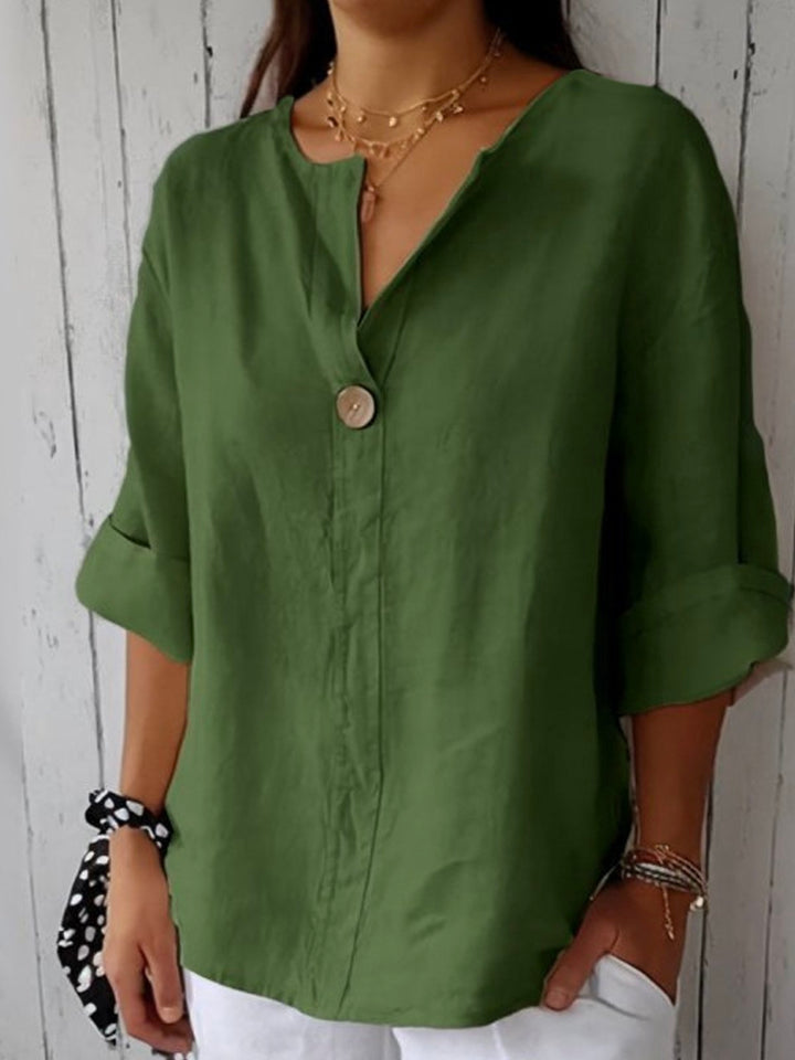 Casualowa lniana bluzka damska, elegancki dekolt w szpic, lekki i opływowy krój, idealna do codziennych stylizacji.