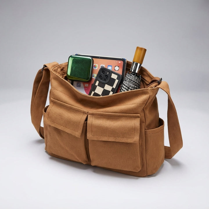 Brązowa płócienna listonoszka crossbody. Praktyczny organizator, duża pojemność, styl unisex na ramię.