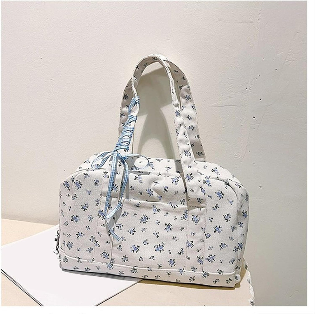 Stylowa płócienna torba duffle Floria, pojemna i elegancka, na podróż lub weekend.