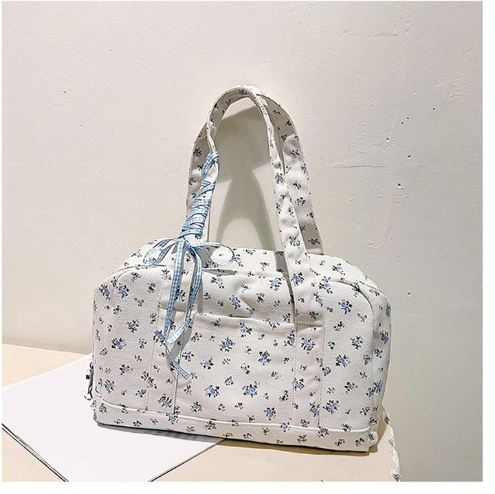 Stylowa płócienna torba duffle Floria, pojemna i elegancka, na podróż lub weekend.