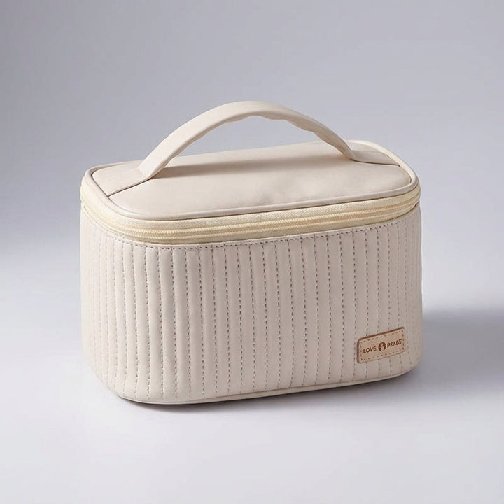 Pikowana kosmetyczka damska NeatCase, elegancka torba z organizerem na kosmetyki w podróży.