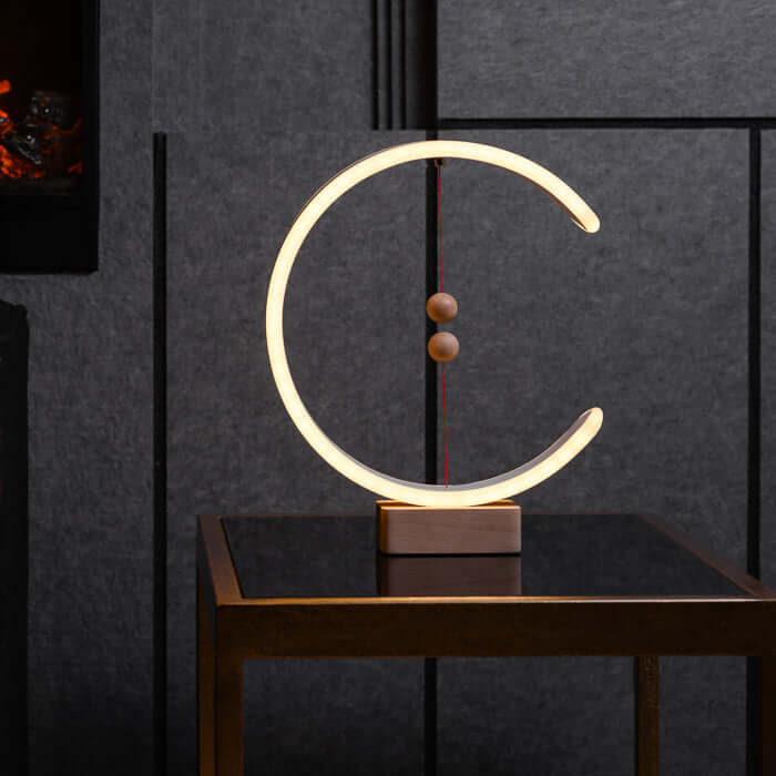 Designerska lampa stołowa półksiężyc