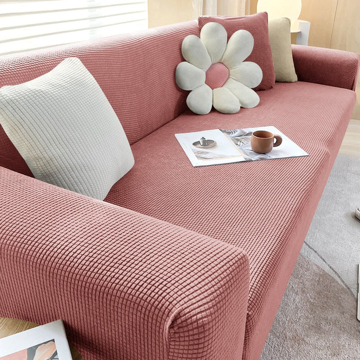 Housse de canapé extensible beige avec motif élégant et design antidérapant, disponible en plusieurs tailles pour salons mode