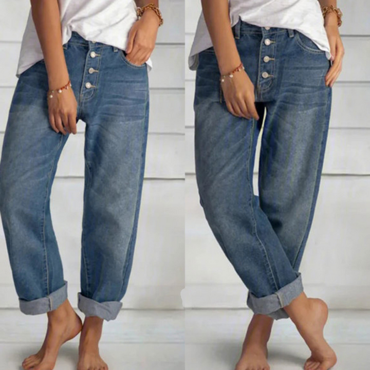 Damskie jeansy vintage z wysokim stanem i prostymi nogawkami, w kolorze niebieskiego denimu, z detalami w postaci wielu guzików z przodu.