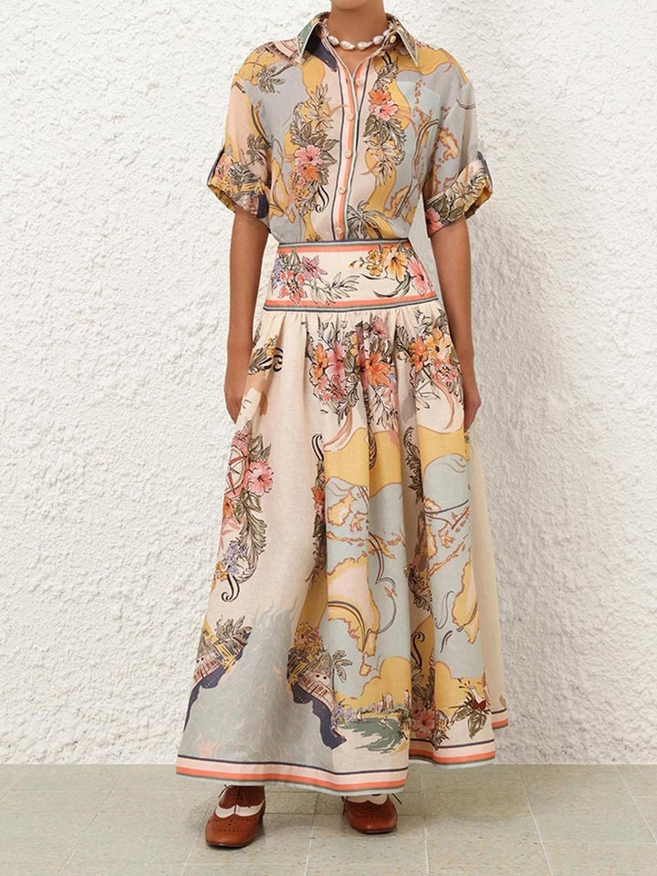 Elegancka spódnica midi z wysokim stanem i delikatnymi kwiatowymi wzorami, idealna do stylu boho i kobiecych stylizacji na każdą porę roku.