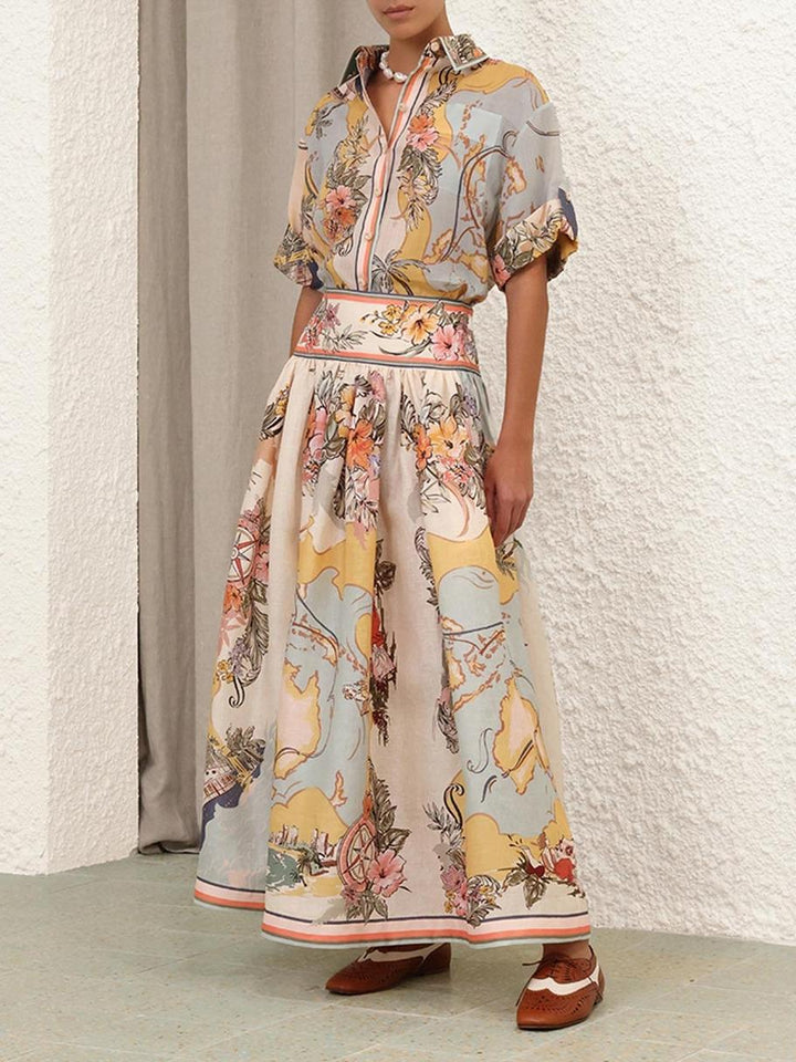 Elegancka spódnica midi z wysokim stanem i delikatnymi kwiatowymi wzorami, idealna do stylu boho i kobiecych stylizacji na każdą porę roku.