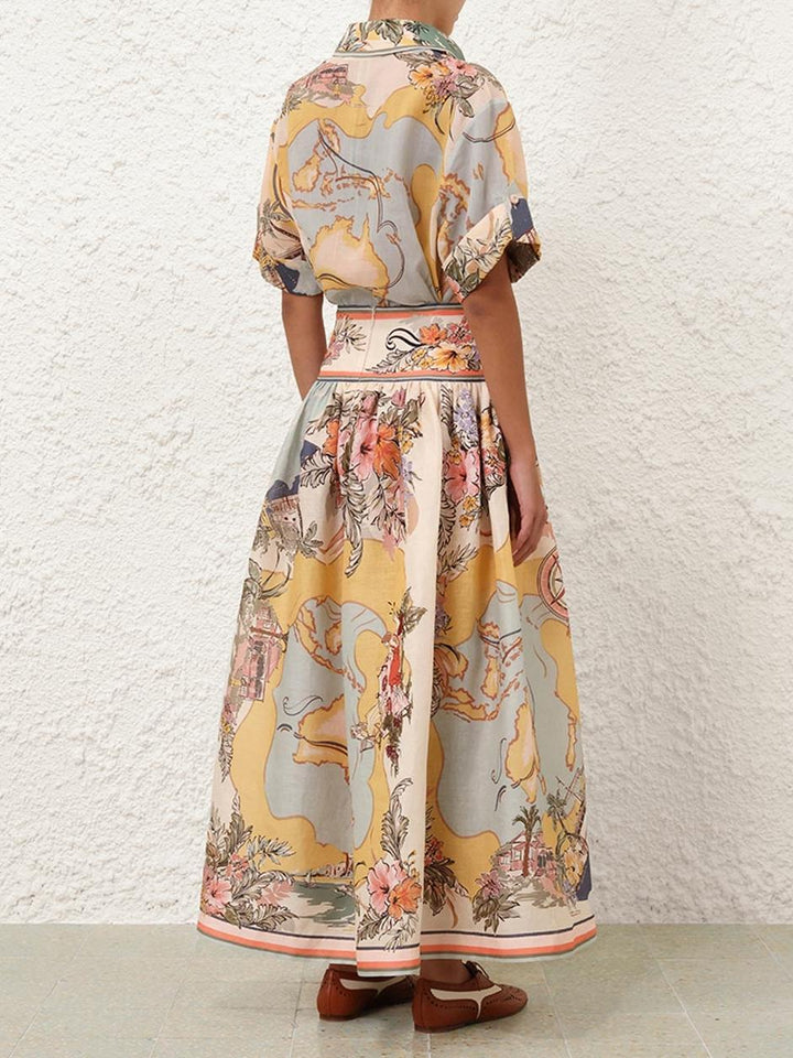 Elegancka spódnica midi z wysokim stanem i delikatnymi kwiatowymi wzorami, idealna do stylu boho i kobiecych stylizacji na każdą porę roku.