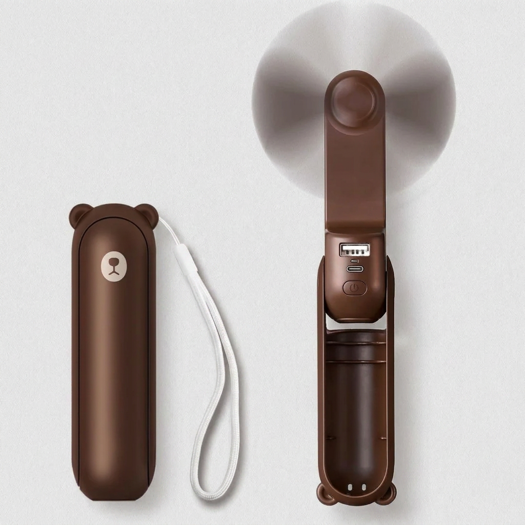 Wielofunkcyjny gadżet podróżny: mini wentylator chłodzący, powerbank i latarka. Niezbędny w podróży.
