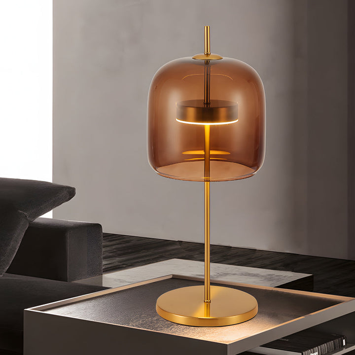 Lampa stołowa z przydymionego szkła, nowoczesny design, miękkie światło, idealna do wystroju wnętrz, ciepła atmosfera.