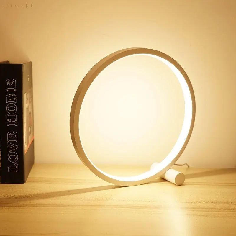 Nowoczesna dotykowa lampa stołowa LED o okrągłym, minimalistycznym designie, zapewniająca eleganckie oświetlenie.