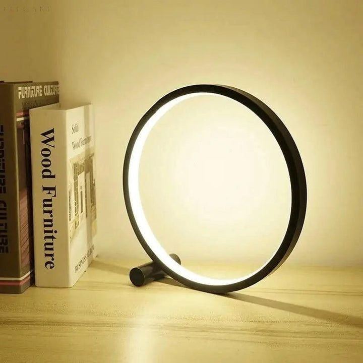 Nowoczesna dotykowa lampa stołowa LED o okrągłym, minimalistycznym designie, zapewniająca eleganckie oświetlenie.
