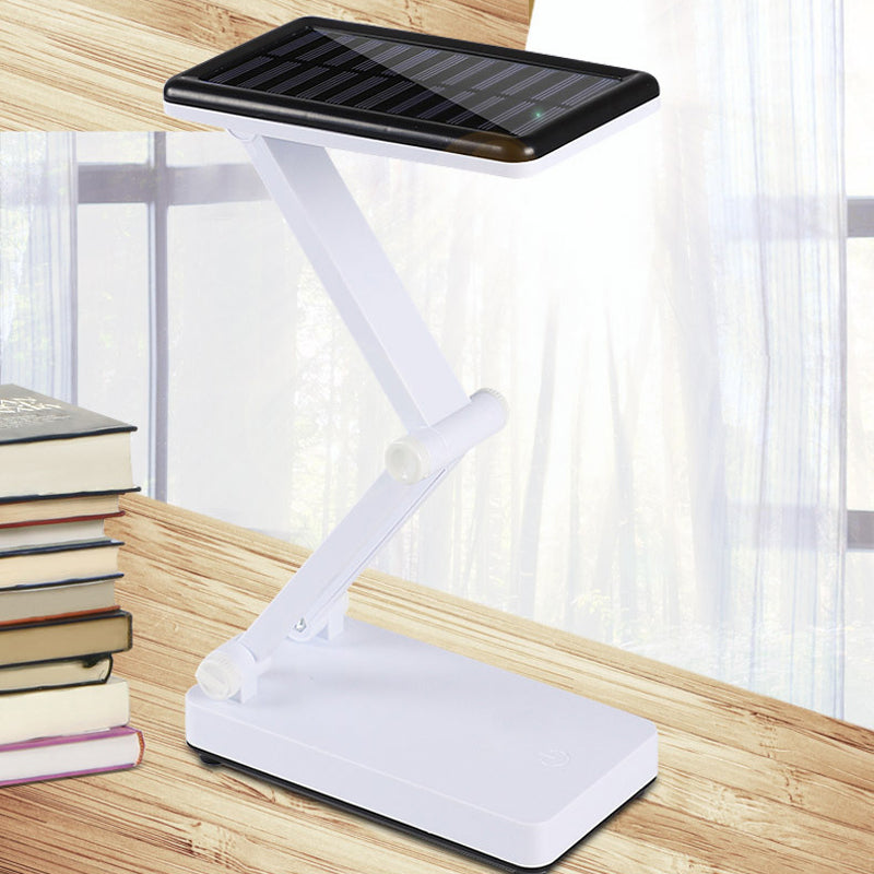 Składana lampa LED solarna, kompaktowa konstrukcja, w kolorach białym, różowym, zielonym do wnętrz i na zewnątrz.