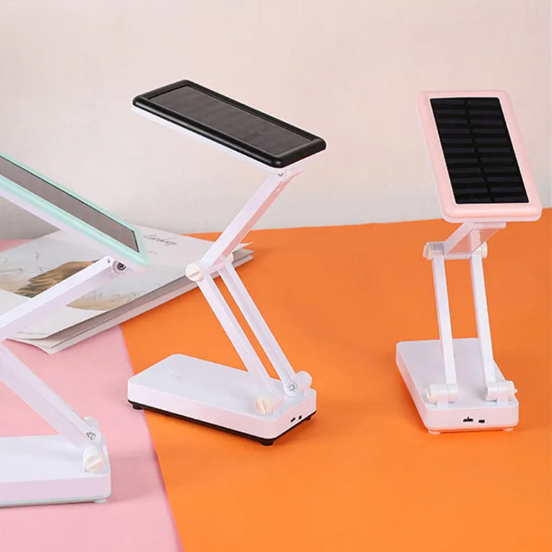 Składana lampa LED solarna, kompaktowa konstrukcja, w kolorach białym, różowym, zielonym do wnętrz i na zewnątrz.