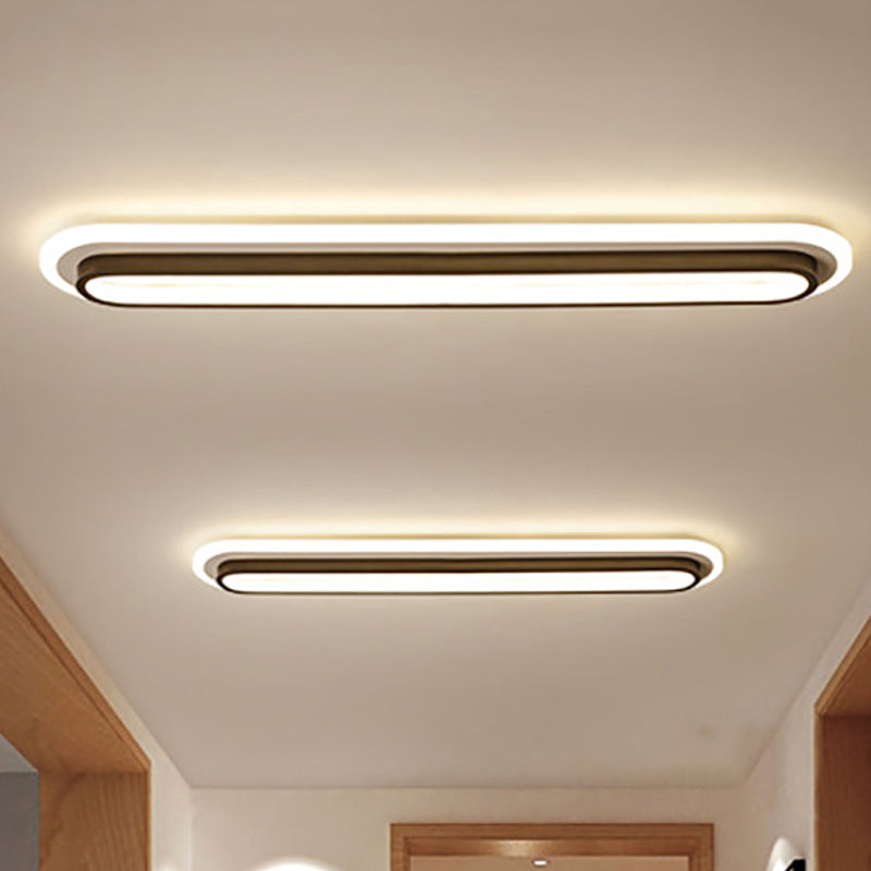 Nowoczesna owalna lampa sufitowa LED w czerni i bieli, elegancki design, akrylowy dyfuzor, współczesna elegancja do wnętrz.
