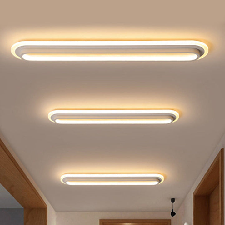 Nowoczesna owalna lampa sufitowa LED w czerni i bieli, elegancki design, akrylowy dyfuzor, współczesna elegancja do wnętrz.