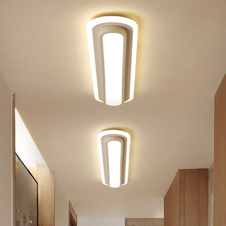 Nowoczesna owalna lampa sufitowa LED w czerni i bieli, elegancki design, akrylowy dyfuzor, współczesna elegancja do wnętrz.