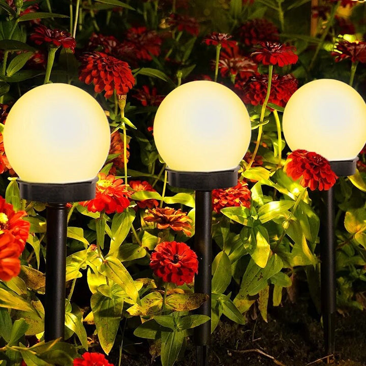 Solarne lampy ogrodowe LED, wodoodporne i ekologiczne, o nowoczesnym dyskowym designie do trwałego oświetlenia zewnętrznego.