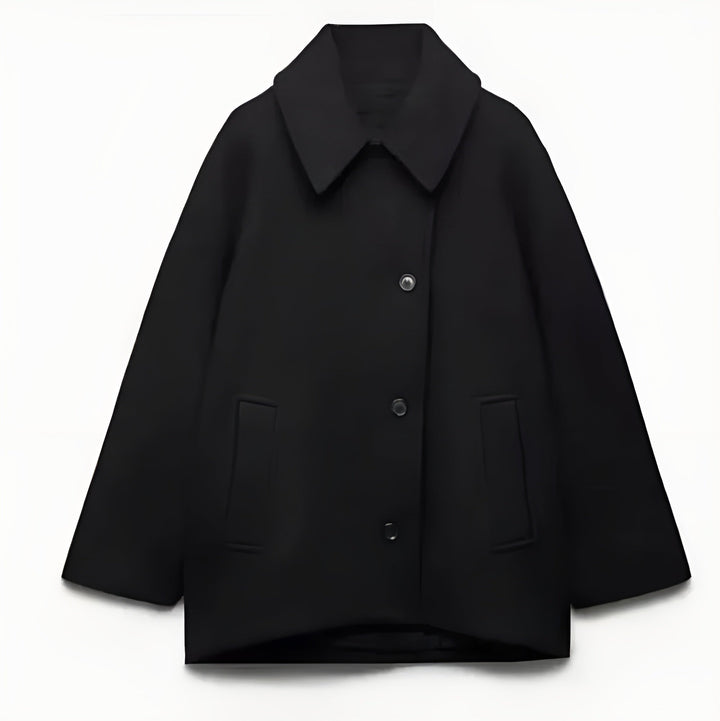 Elegancki, oversize'owy płaszcz wełniany, idealny na zimę, zapewniający komfort i styl.