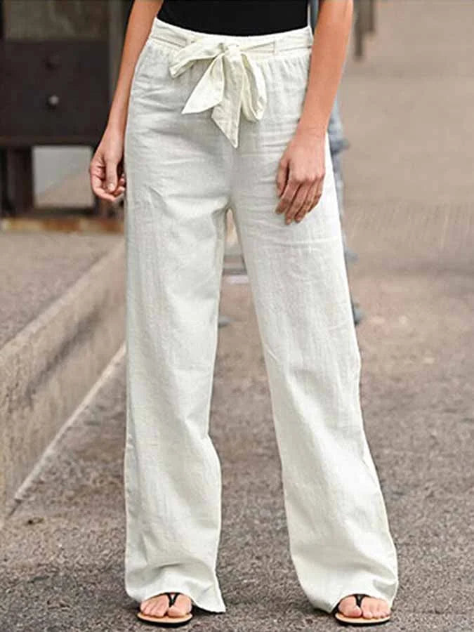 Damskie letnie spodnie lniane, wysoki stan, luźny krój, lekkie i przewiewne dla letniej elegancji.