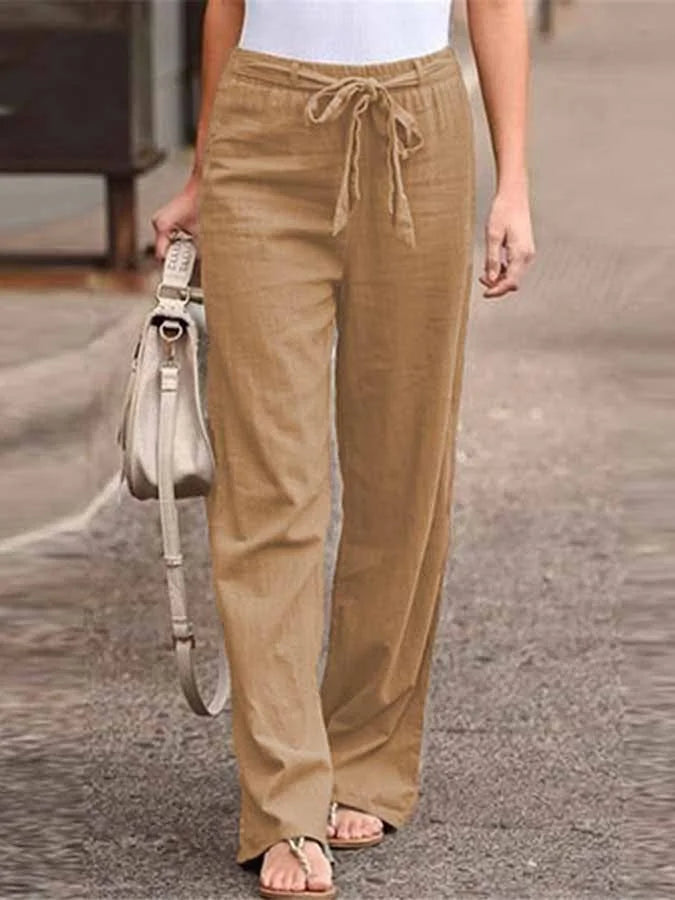 Damskie letnie spodnie lniane, wysoki stan, luźny krój, lekkie i przewiewne dla letniej elegancji.