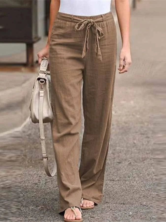 Damskie letnie spodnie lniane, wysoki stan, luźny krój, lekkie i przewiewne dla letniej elegancji.