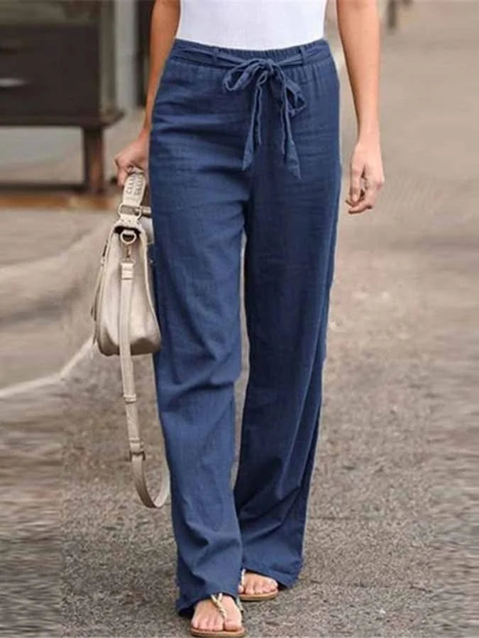 Damskie letnie spodnie lniane, wysoki stan, luźny krój, lekkie i przewiewne dla letniej elegancji.