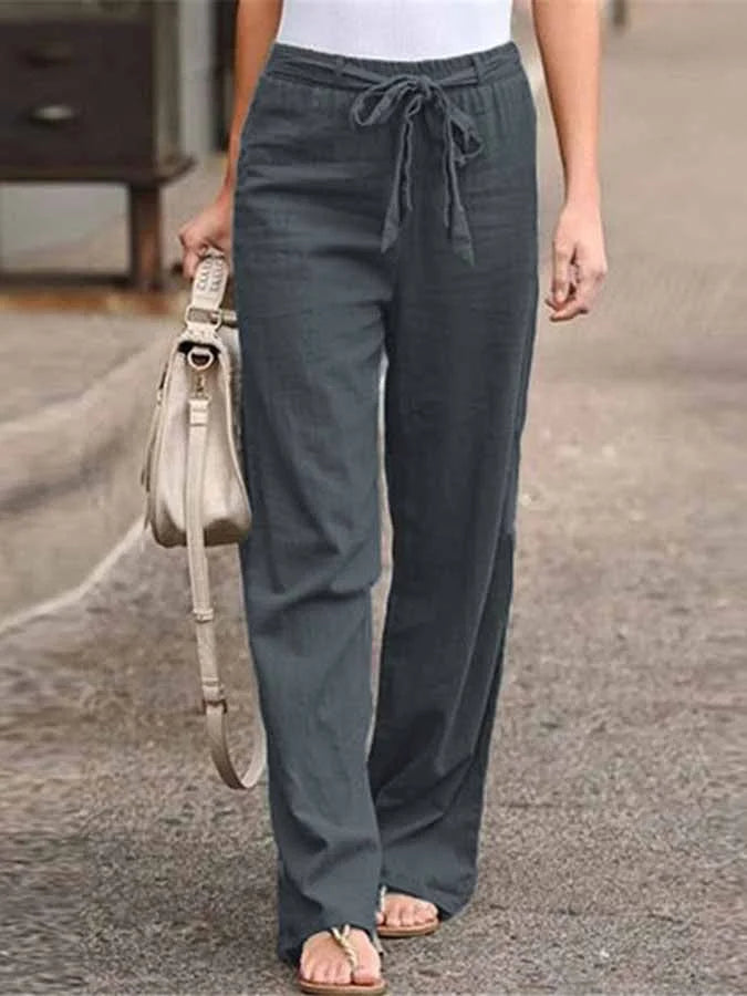 Damskie letnie spodnie lniane, wysoki stan, luźny krój, lekkie i przewiewne dla letniej elegancji.