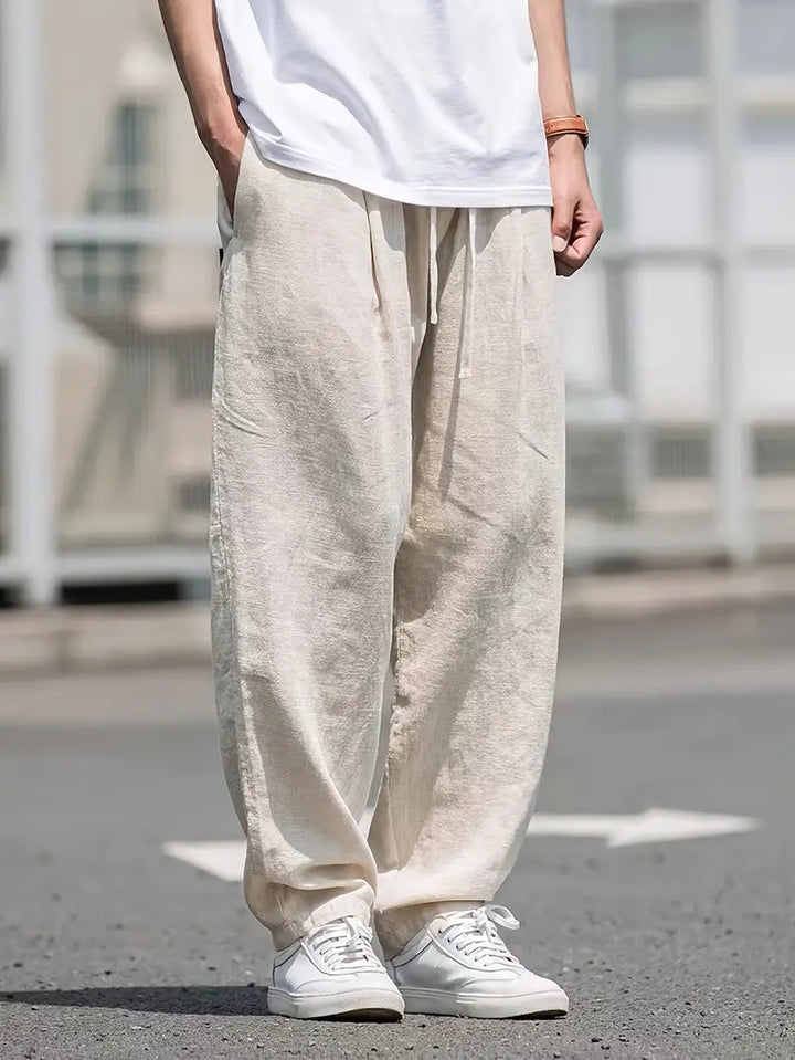 Męskie lniane spodnie typu wide leg, lekkie, oddychające, nowoczesny design zapewniający letni komfort, elegancki styl casualowy