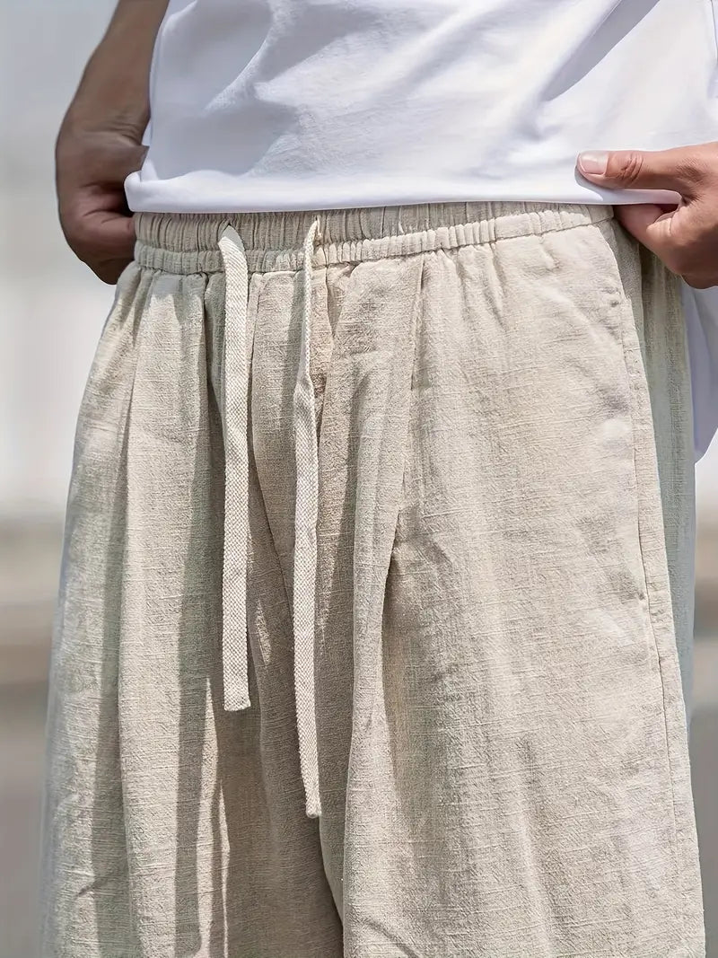 Męskie lniane spodnie typu wide leg, lekkie, oddychające, nowoczesny design zapewniający letni komfort, elegancki styl casualowy