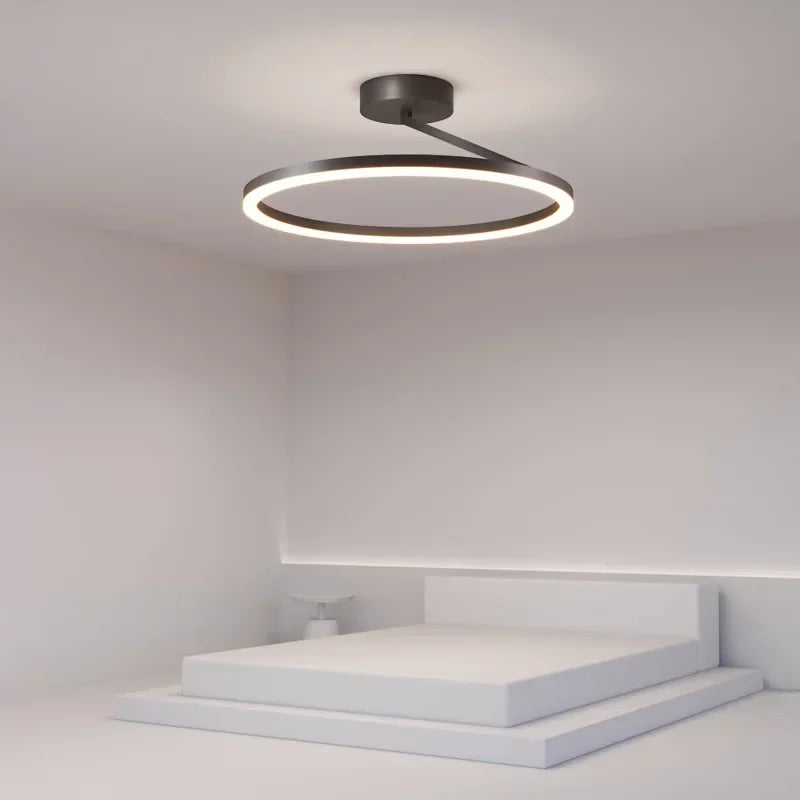 Skandynawski plafon LED w kształcie okręgu, minimalistyczny design, ciepłe białe światło dla miękkiej i relaksującej atmosfery.