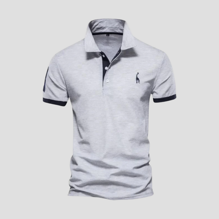 Klasyczna, wygodna koszulka polo męska w granatowym kolorze, prezentująca elegancki krój i wysoką jakość materiału.