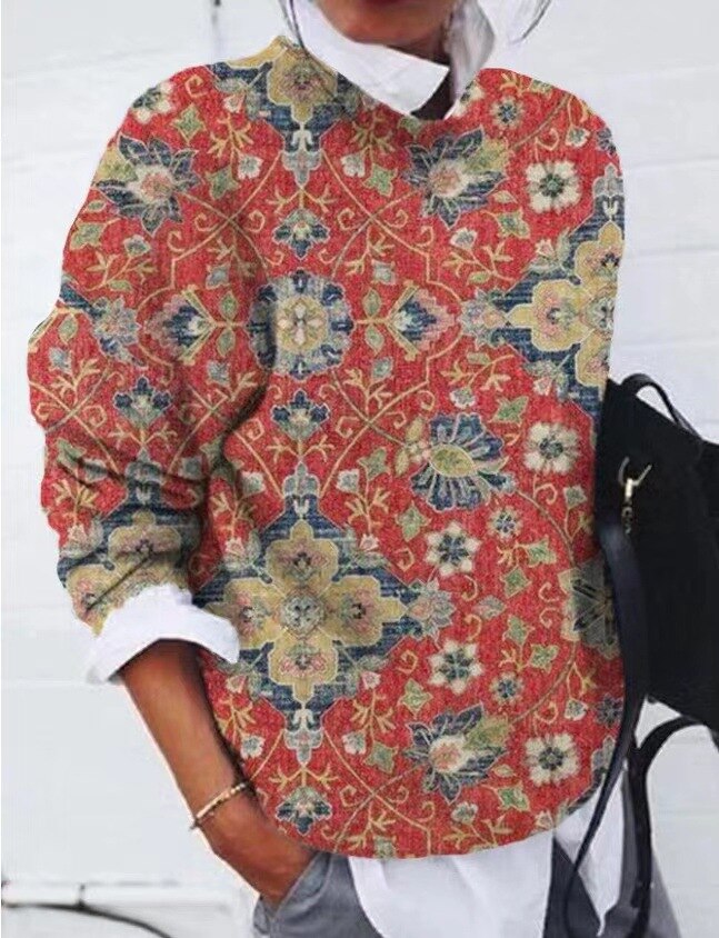 Elegancki sweter damski z delikatnym kwiatowym wzorem, wykonany z mieszanki bawełny, zapewniający komfortowy i pochlebny wygląd.