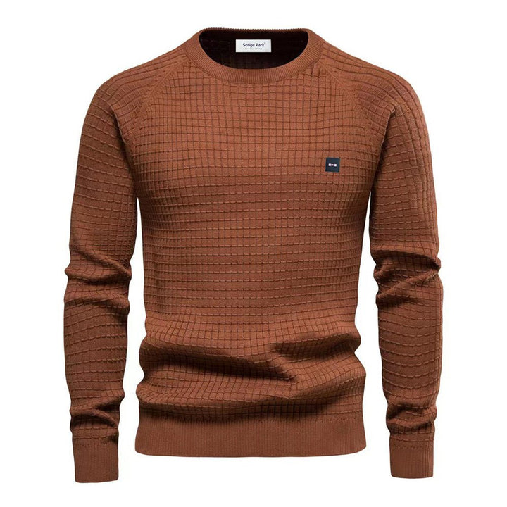 Sweter męski Bjorn w beżowym kolorze, elegancki wygląd, miękki i komfortowy materiał, idealny do casualowych outfitów.