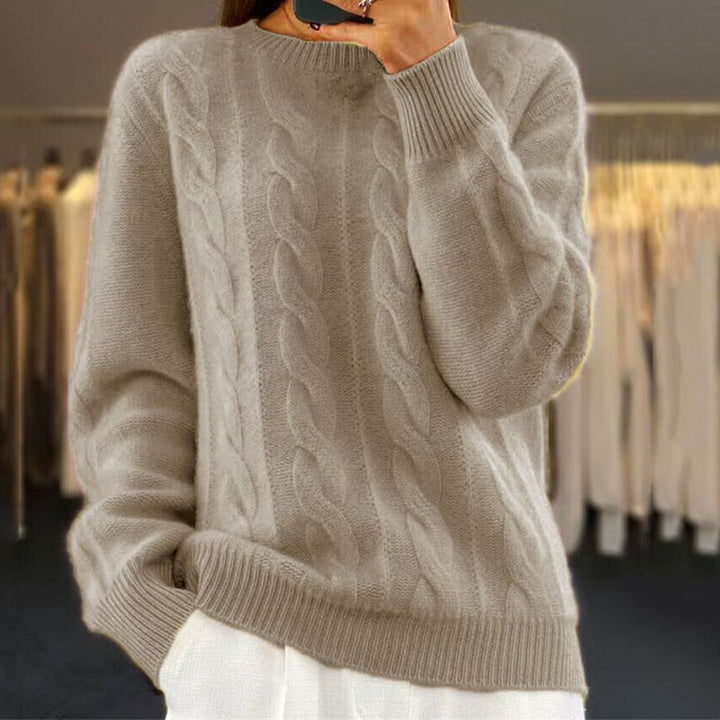 Damski sweter dziergany z miękkiej wełny, elegancki i komfortowy, z koronkowym wzorem, idealny na zimę lub wiosnę.