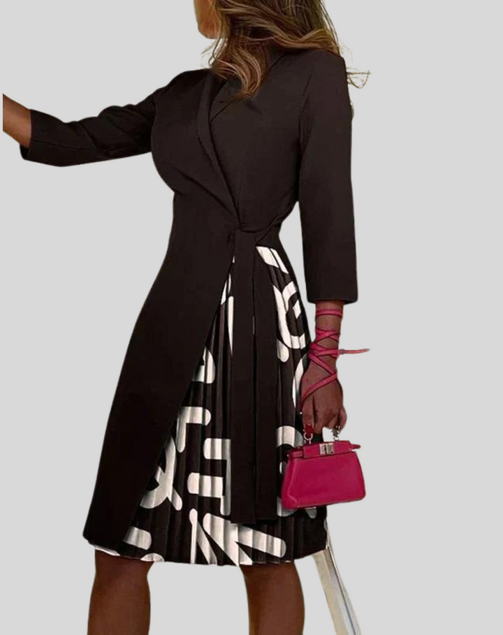 Elegancka sukienka blazer Janis w kolorze czarnym o strukturalnym kroju, z detalami w stylu office-chic, idealna na każdą okazję.