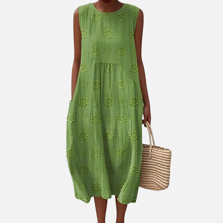 Szykowna bawełniana sukienka boho, midi, bez rękawów, o swobodnym kroju, z kieszeniami, geometrycznym wzorem, idealna na lato.
