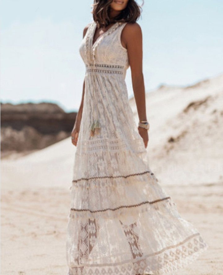 Płynna sukienka boho Agatha z wzorami boho, z bawełny i lnu, z haftowanymi detalami i frędzlami, luźny styl letni.