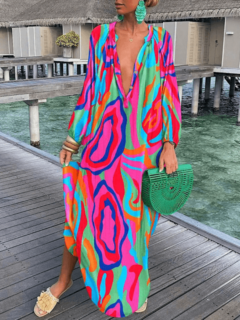 Niebieska sukienka boho Rosalia z kwiatowym wzorem, zwiewna i elegancka, idealna na lato, szykowna i swobodna.
