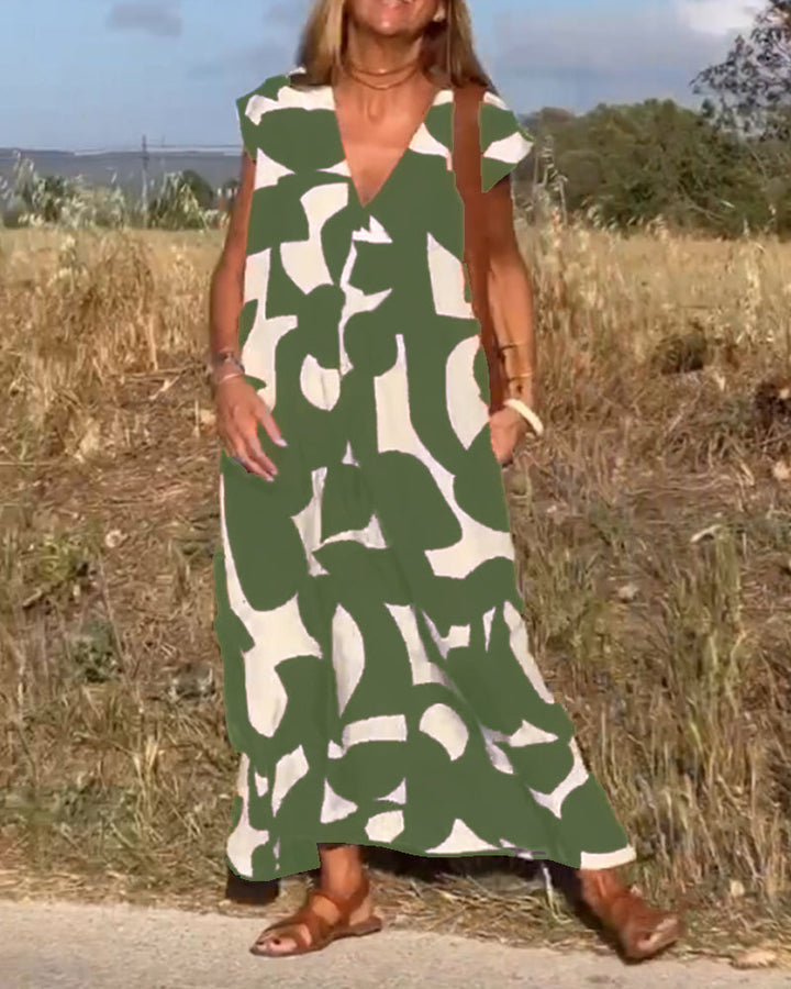 Sukienka Camille z eleganckim wzorem i dekoltem V, widok z przodu, kobieca, modna sukienka dla kobiet, miękki i oddychający materiał.