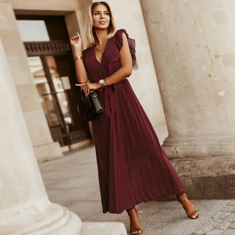 Bohemska suknia ślubna z eleganckimi falbanami, maxi krój, wyrafinowane i szykowne detale na wesela i wyjątkowe okazje.
