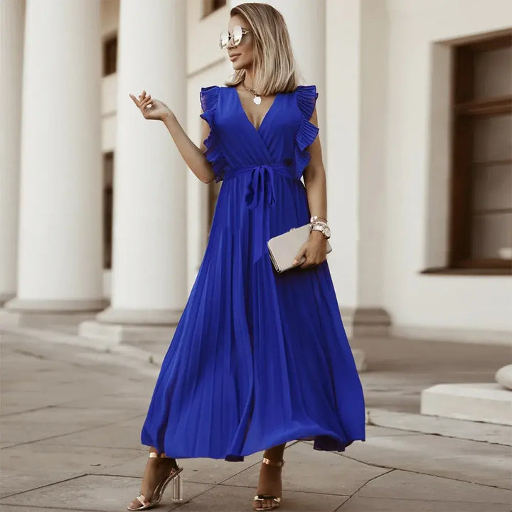 Bohemska suknia ślubna z eleganckimi falbanami, maxi krój, wyrafinowane i szykowne detale na wesela i wyjątkowe okazje.